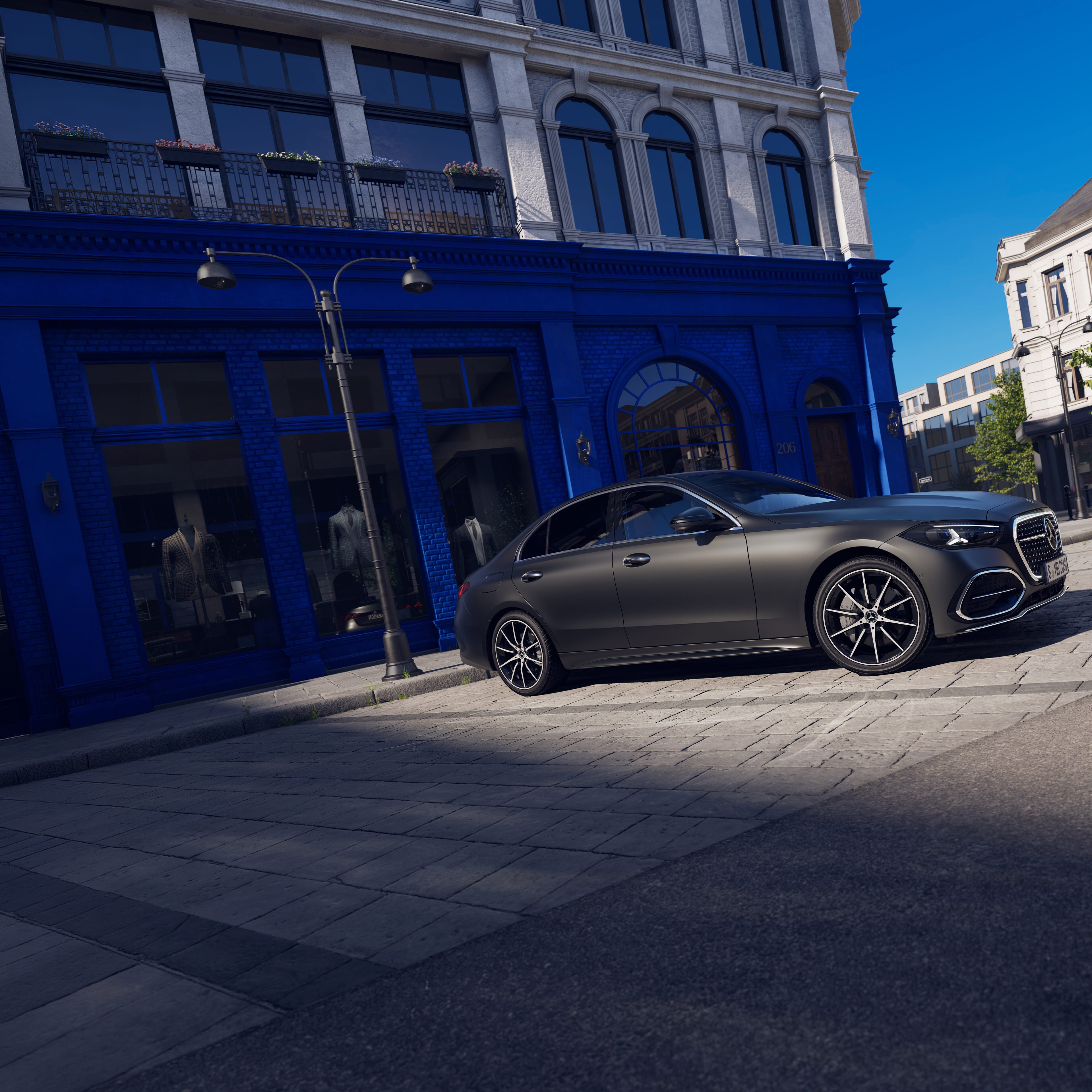 Visual de un Clase C Berlina de color gris de Mercedes-Benz aparcado en una calle