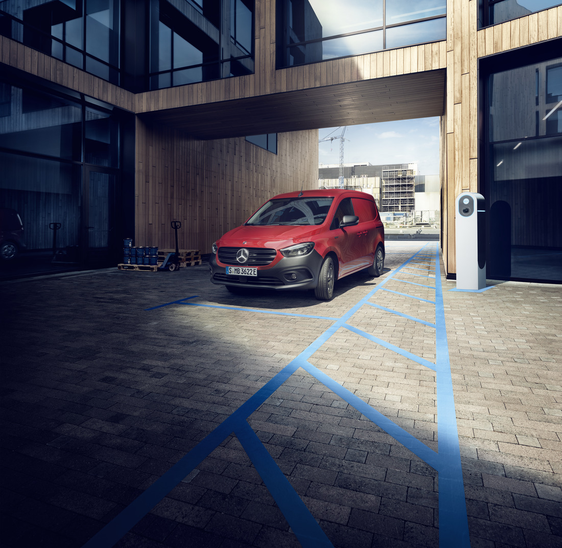 The Mercedes-Benz eCitan Panel Van is parked in front of a building.