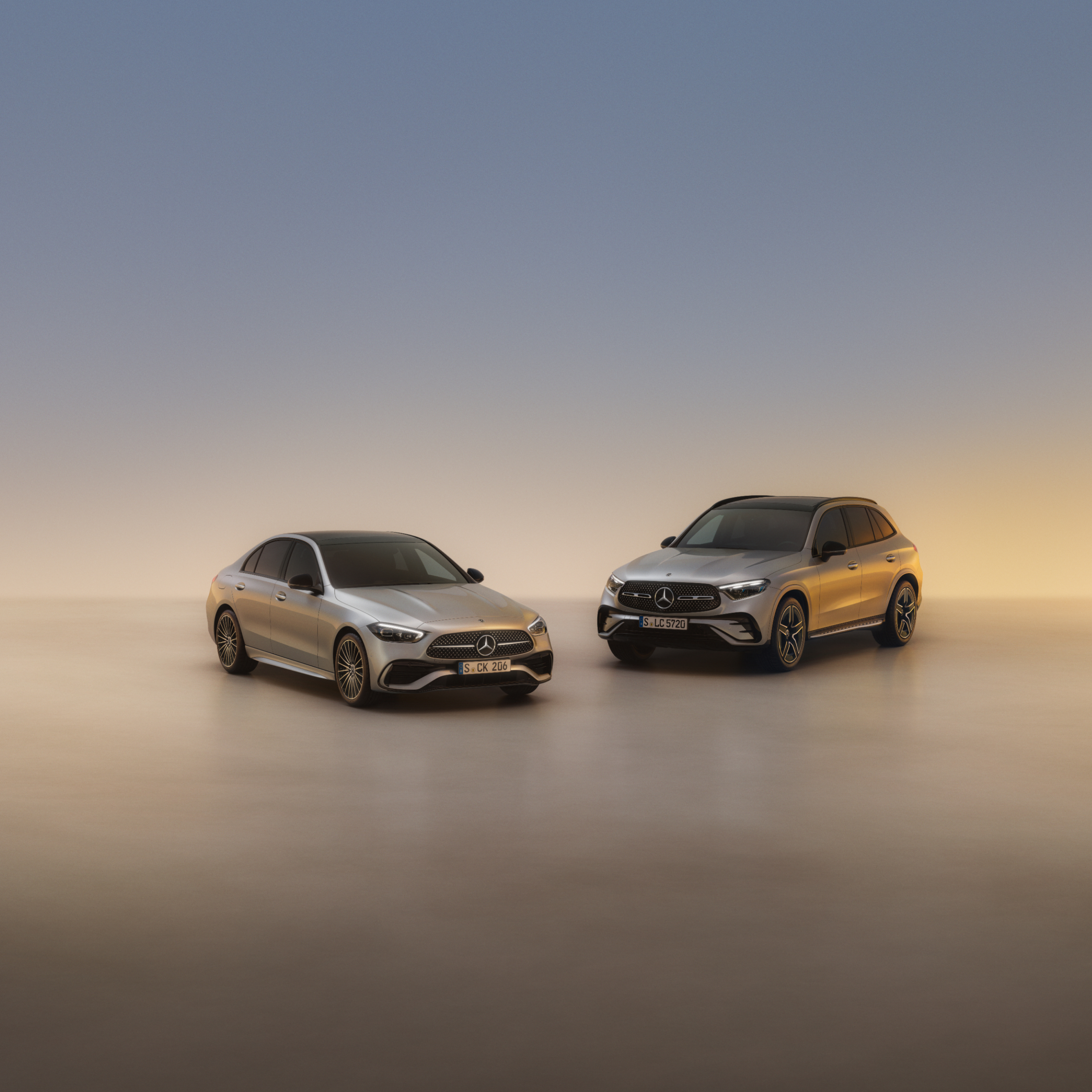 Empresas | Mercedes-Benz visual de un Clase C y un GLC en color gris con un fondo gris con un destello dorado